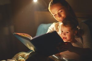 Children reading stories with parents in Miami